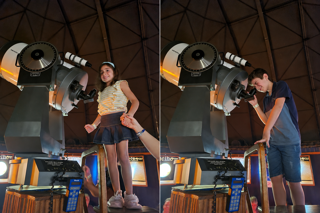 Davi e Amanda observando o céu noturno por um telescópio no CEU, em Brotas.